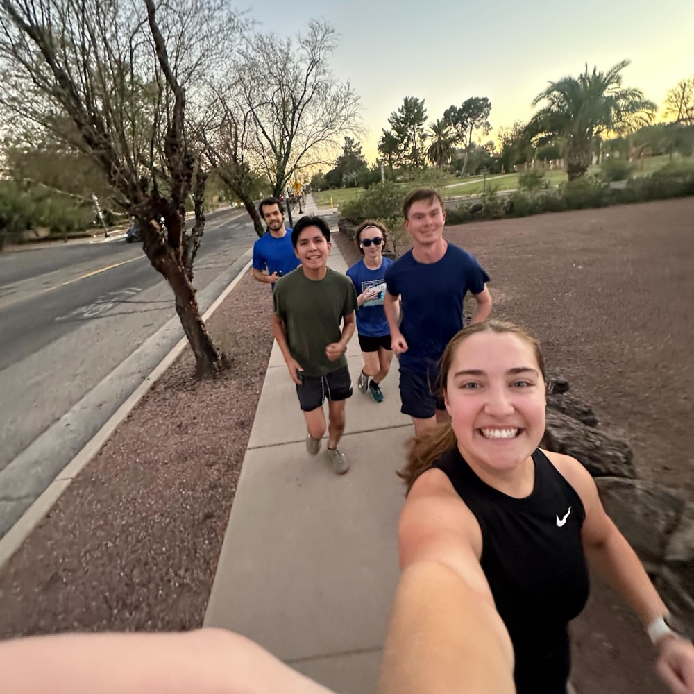 Wildcat Running Club members smiling during a group run